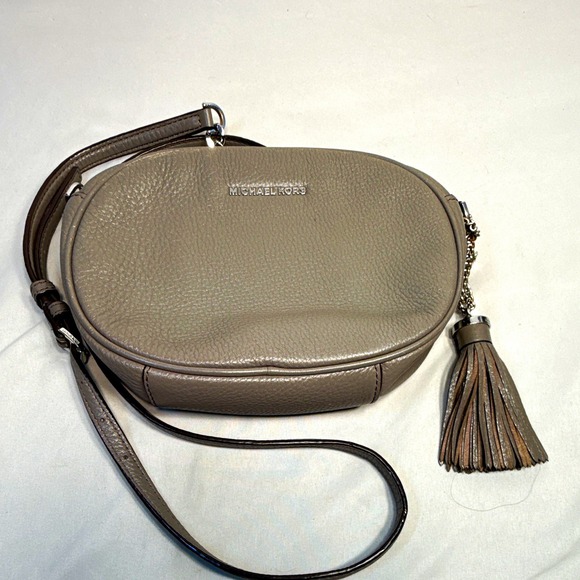 Michael Kors Handbags - Michael Kors Small Gray Pebbled Oval Crossbody Bag Chain Tassel Zip